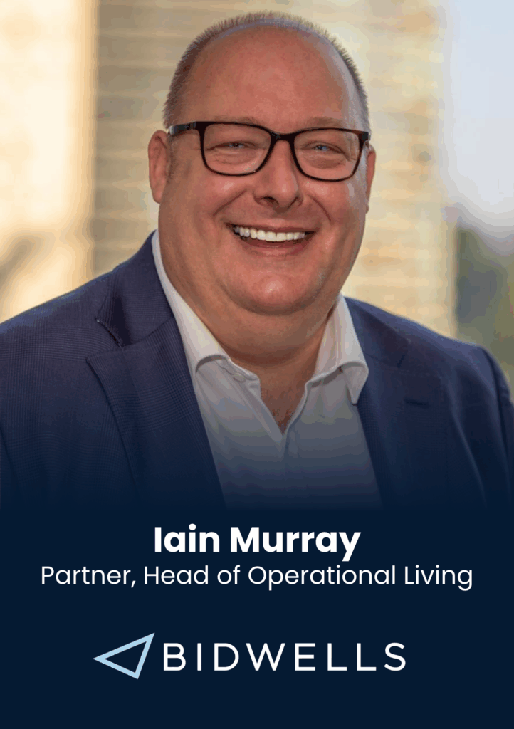 Head-and-shoulders portrait of Iain Murray in a navy suit and glasses, smiling; banner includes his name and Bidwells branding in the background.