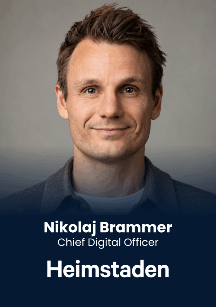 Portrait of Nikolaj Brammer, Chief Digital Officer, smiling against a gray backdrop (head and shoulders).