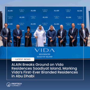 Ceremonial ground-breaking event for VIDA Residences Saadiyat Island with executives and dignitaries holding shovels in front of a blue branded backdrop.