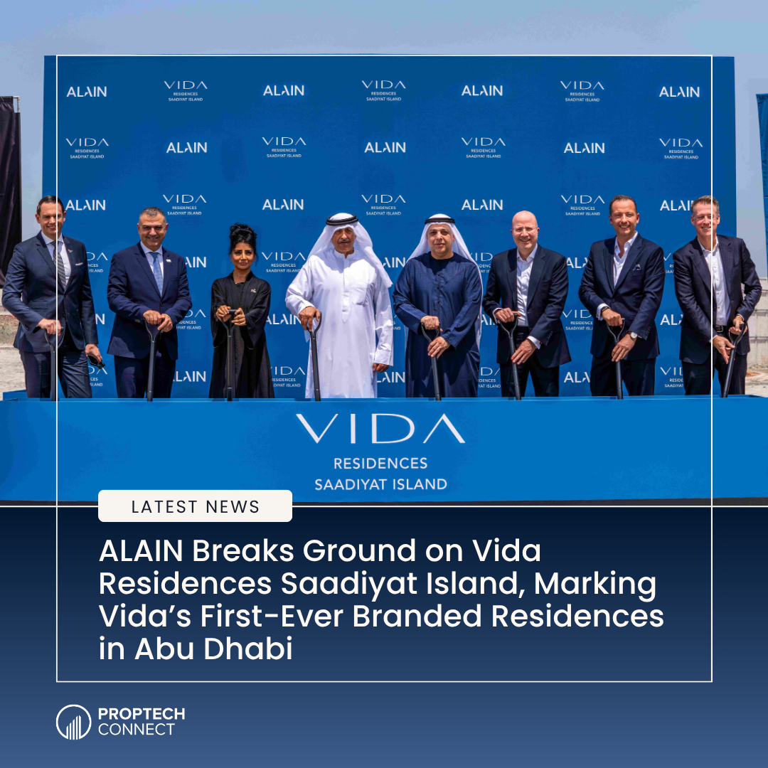Ceremonial ground-breaking event for VIDA Residences Saadiyat Island with executives and dignitaries holding shovels in front of a blue branded backdrop.