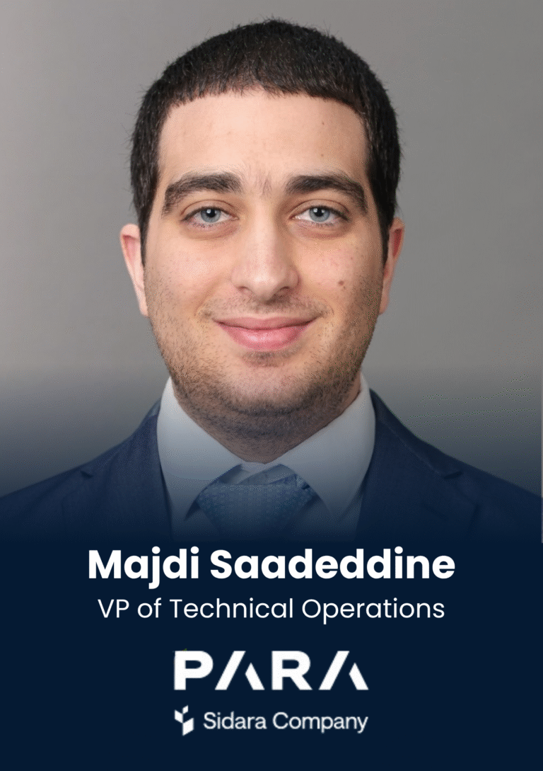 Portrait of Majdi Saadeddine, VP of Technical Operations, in a navy suit and light shirt.