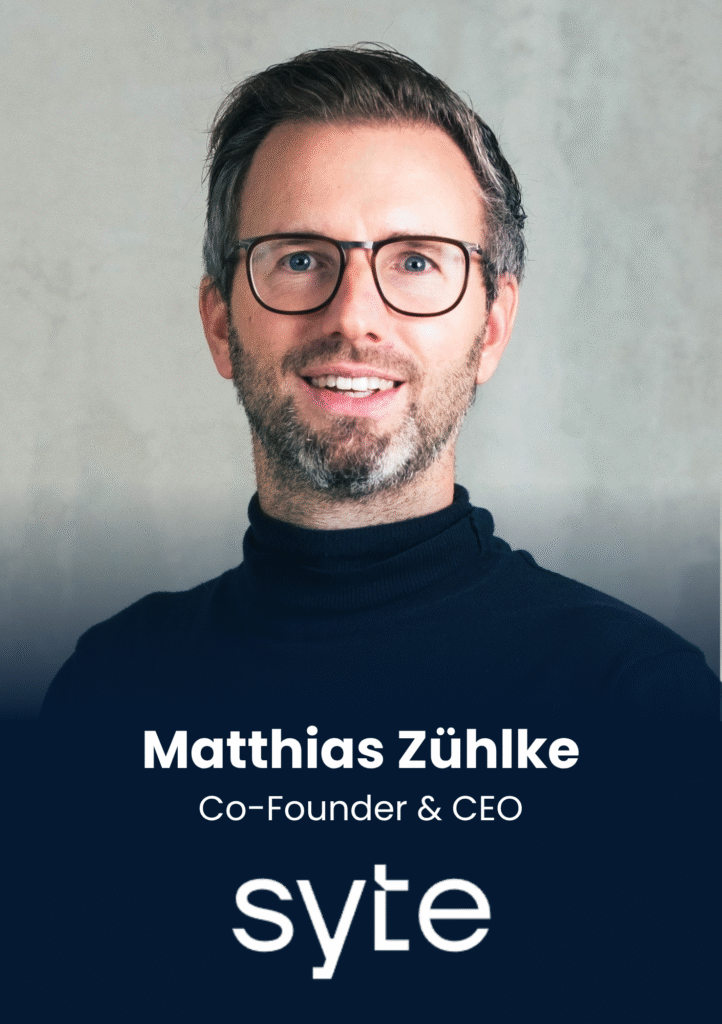 Portrait of a man with glasses and a dark turtleneck, smiling at camera, background is neutral gray, name overlay reads ‘Matthias Zühlke’, Co-Founder & CEO (informational image).