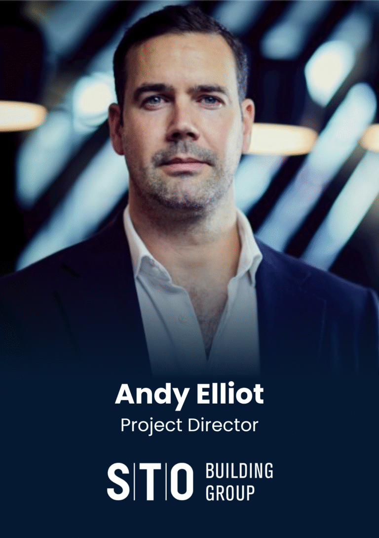 Portrait of Andy Elliot, Project Director, in a professional setting with STO Building Group branding in the background.