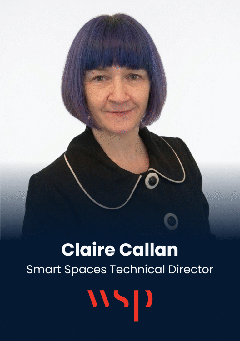 Head-and-shoulders portrait of Claire Callan, Smart Spaces Technical Director, with a blue‑purple bob haircut and a black outfit against a light background.
