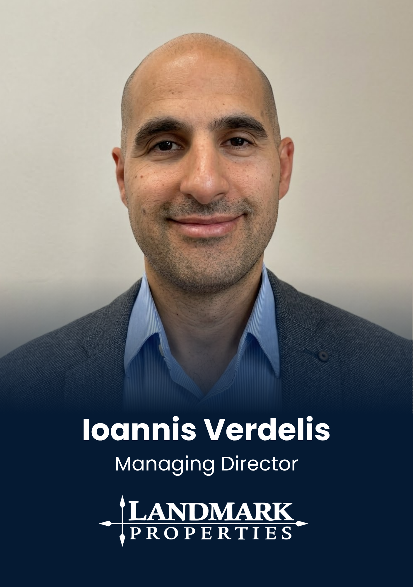 Portrait of Ioannis Verdelis, managing director, wearing a blue shirt and gray blazer in a head-and-shoulders shot to represent a corporate profile.