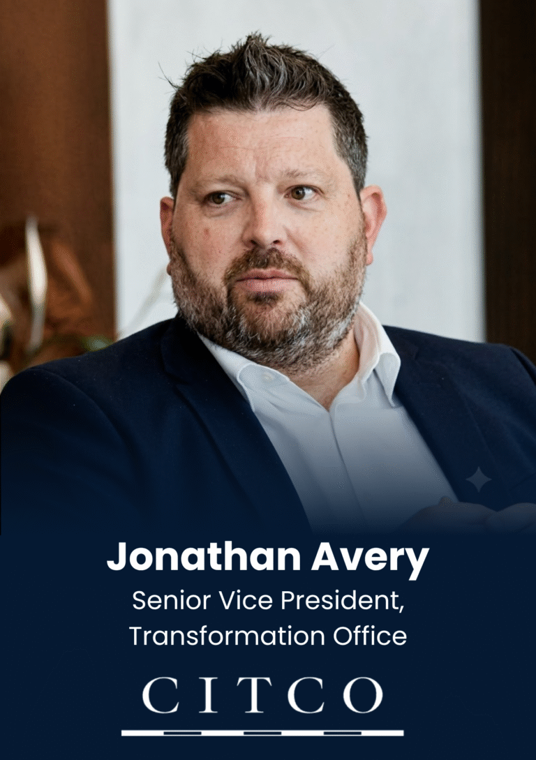 Portrait of Jonathan Avery, Senior Vice President of the Transformation Office, wearing a navy blazer and white shirt in a formal head-and-shoulders shot.