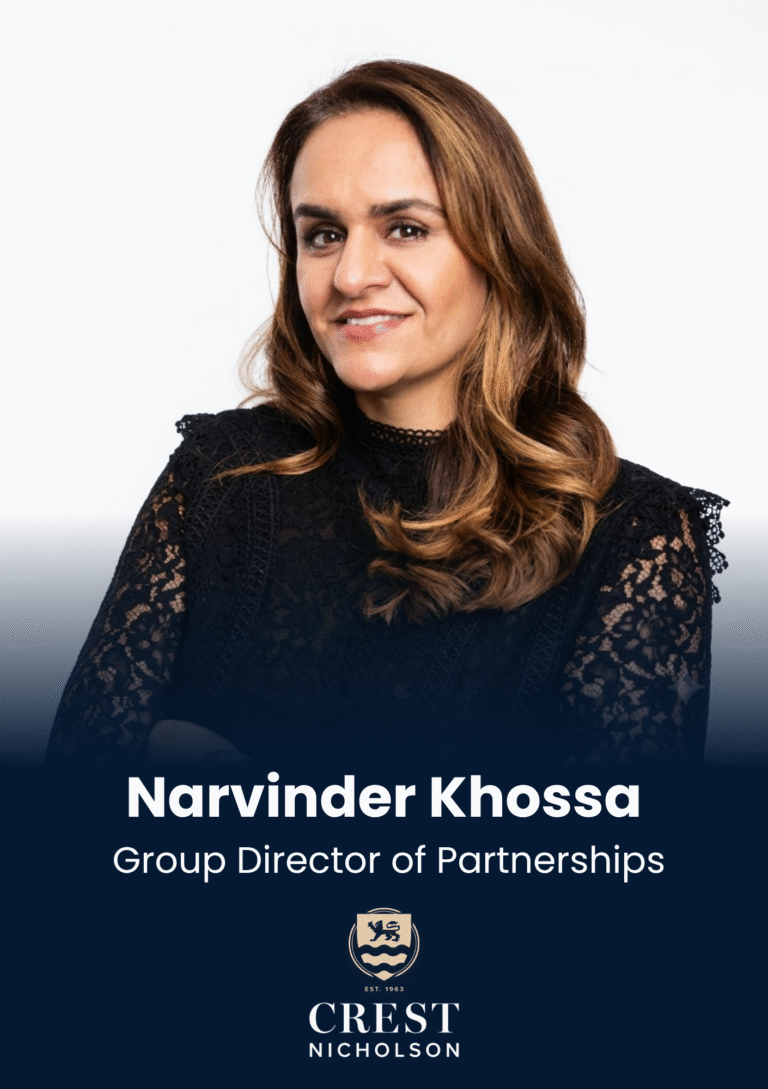 Portrait of Narvinder Khossa, Group Director of Partnerships, smiling in a black lace top with Crest Nicholson branding visible at the bottom.