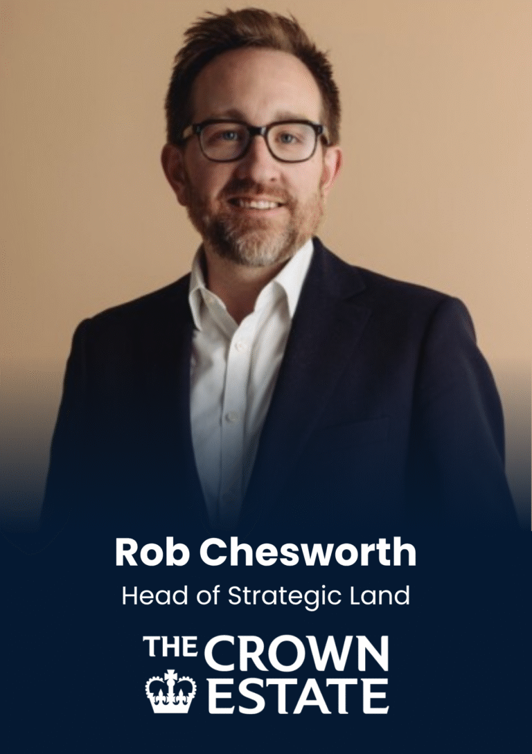 Rob Chesworth, Head of Strategic Land at The Crown Estate, smiling in a navy blazer and glasses.