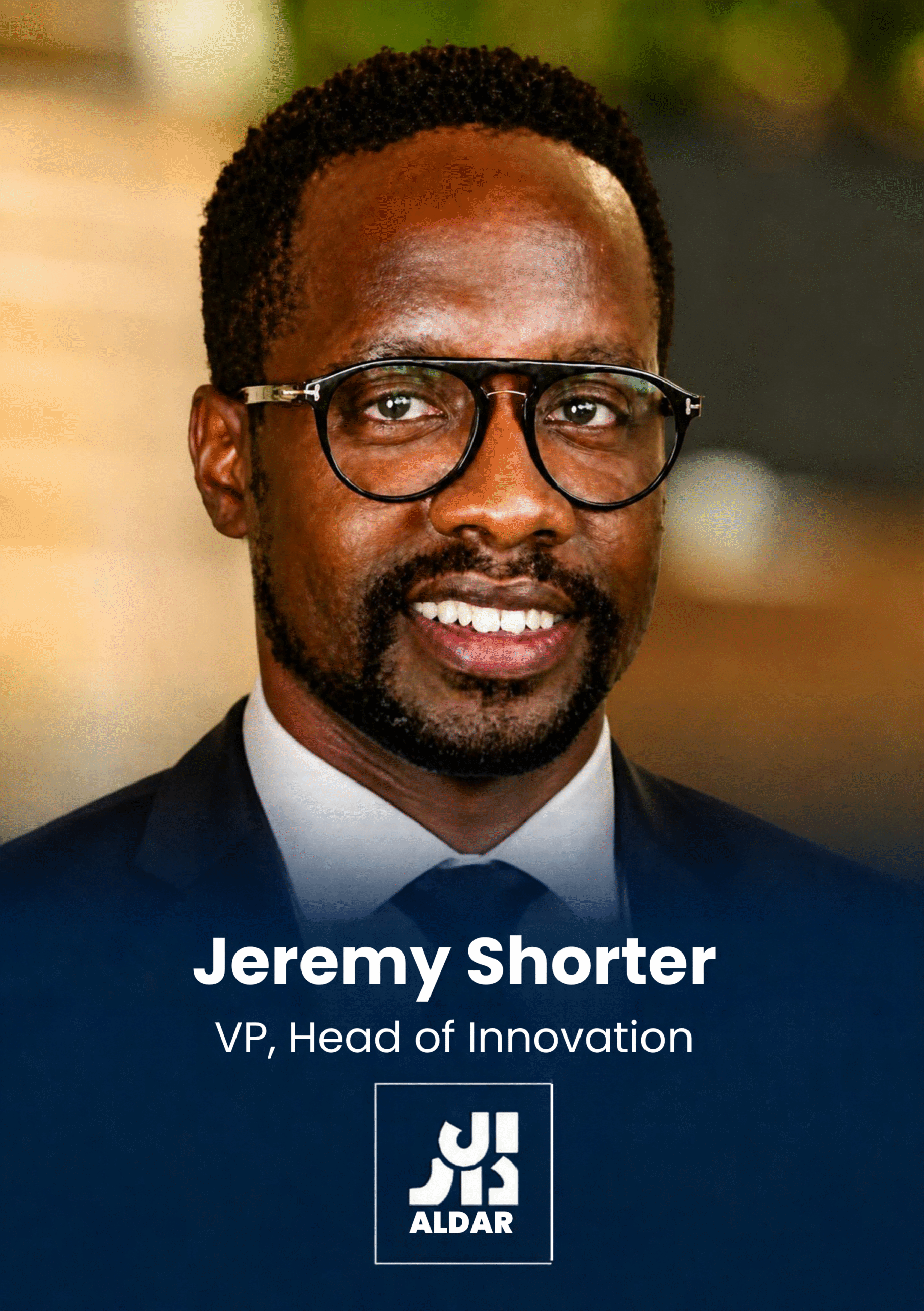 Close-up of a smiling man in a suit wearing glasses; overlay text reads 'Jeremy Shorter, VP, Head of Innovation' with the ALDAR logo.