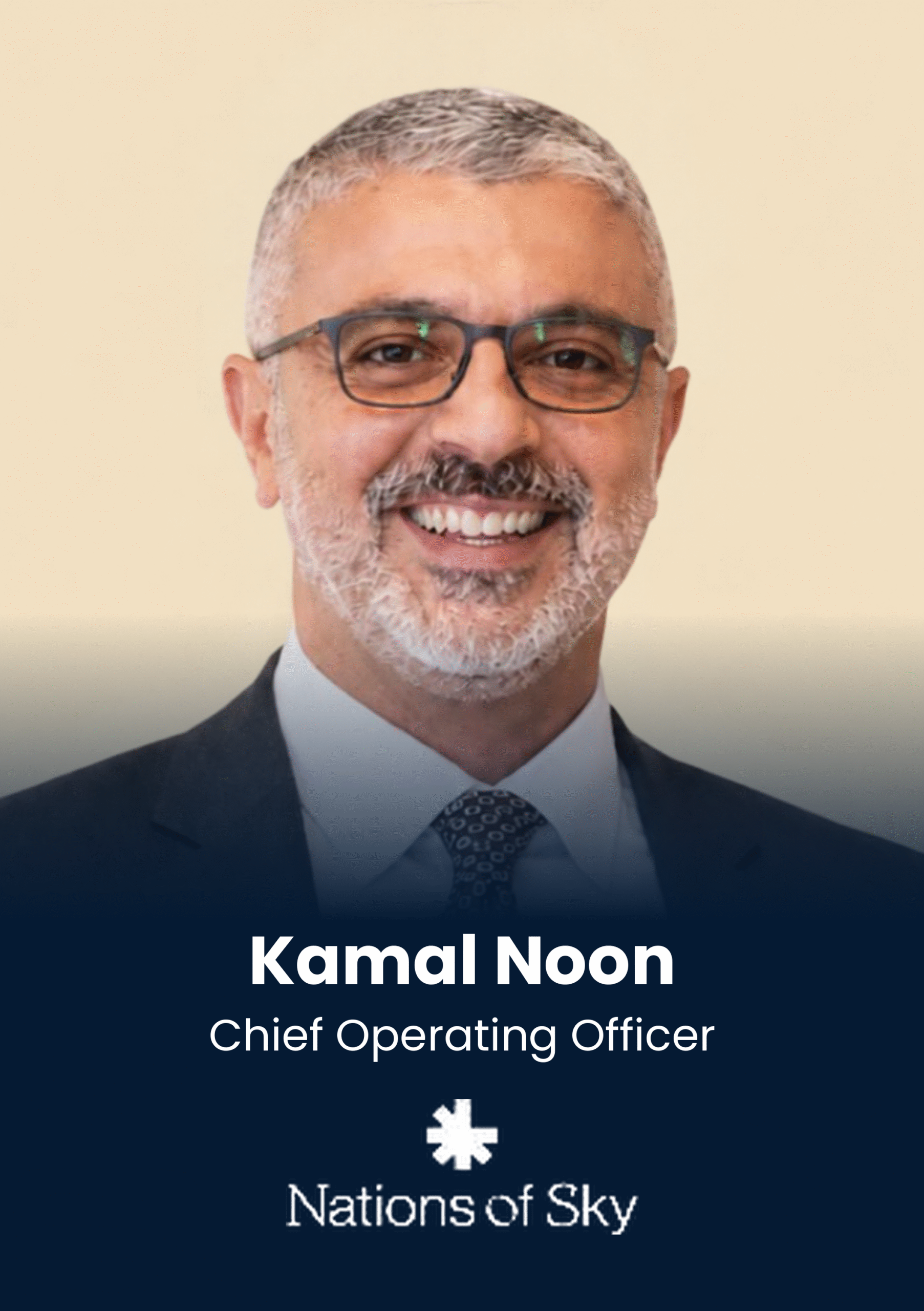 Portrait of Kamal Noon, Chief Operating Officer, Nations of Sky (head and shoulders, smiling in a suit)