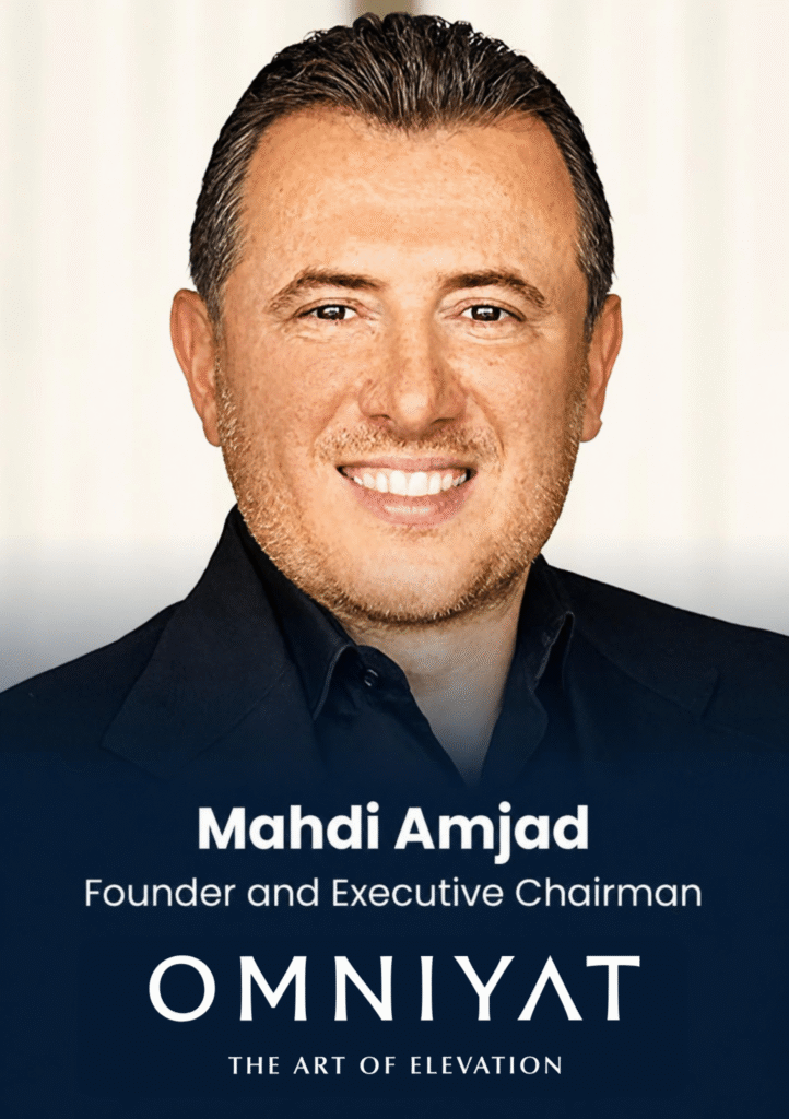 Portrait of Mahdi Amjad, founder and executive chairman, smiling in a dark suit with Omnyyat branding in the background.