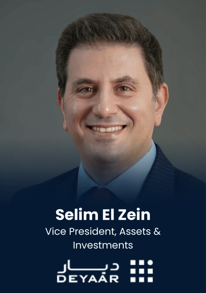 Professional headshot of Selim El Zein, Vice President of Assets & Investments, wearing a blue suit against a dark gradient background with a company logo.